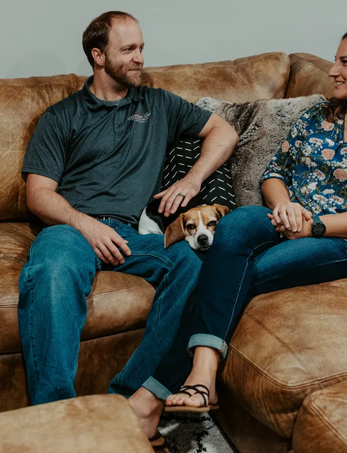 Leather Sectional with Dog and Couple