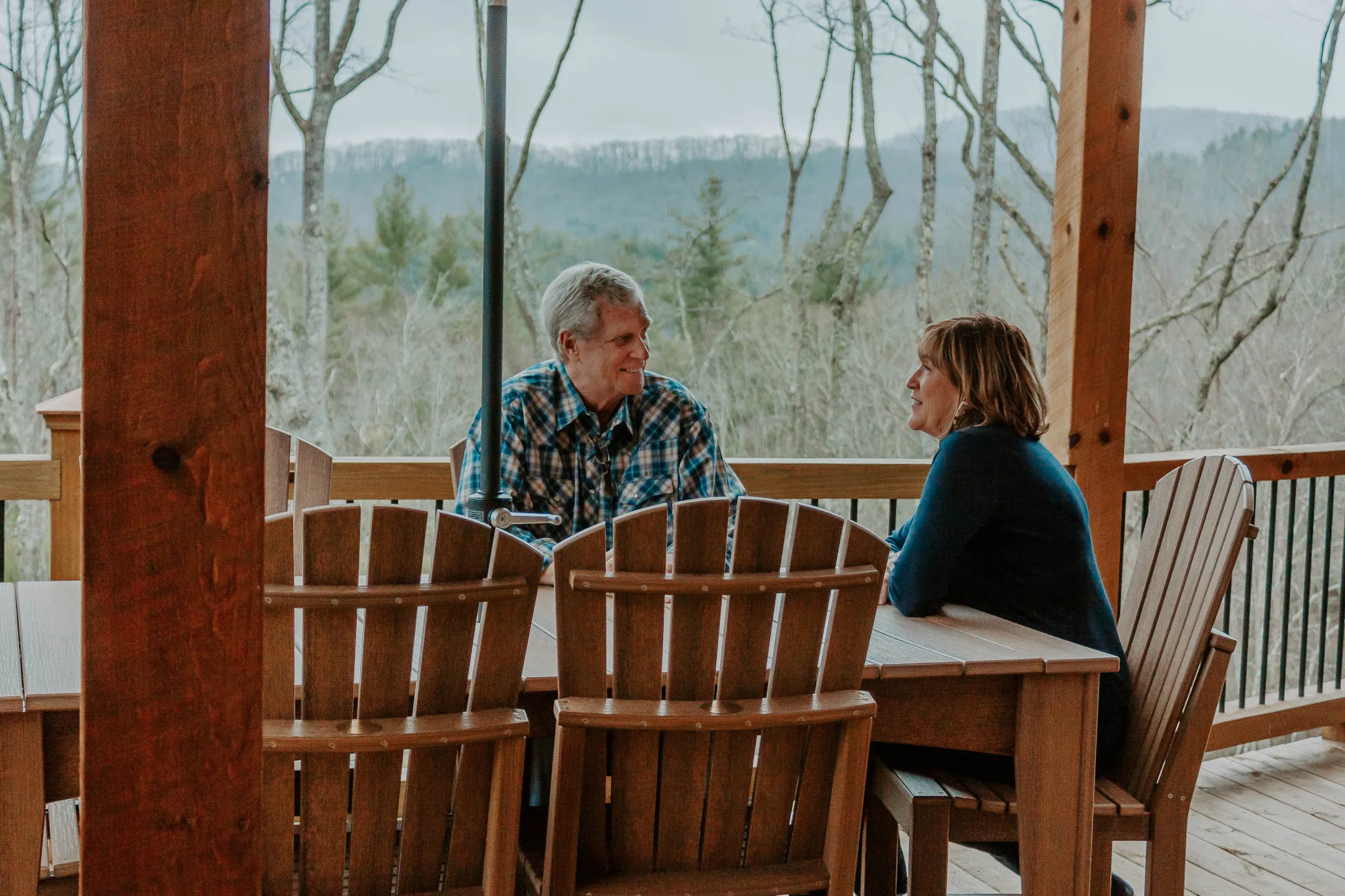 Couple Sitting Outside at Poly Furniture Dining Table