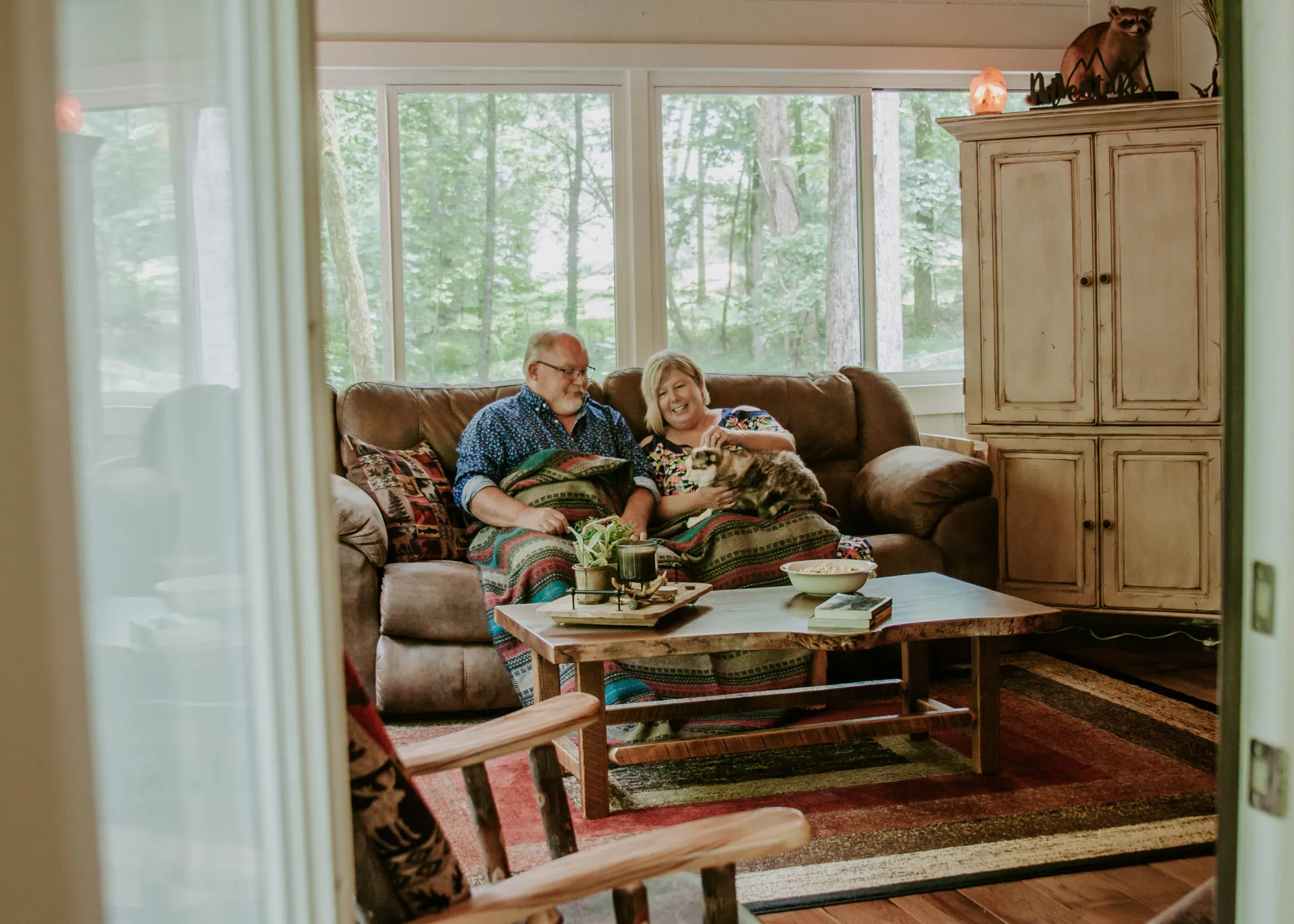 Couple on Leather Couch by Fireplace small home