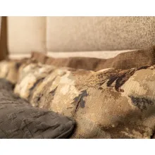 upholstered headboard bed with rustic bed spread